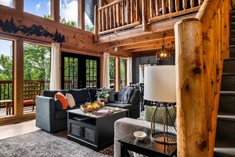 Great room with vaulted ceiling and tall windows